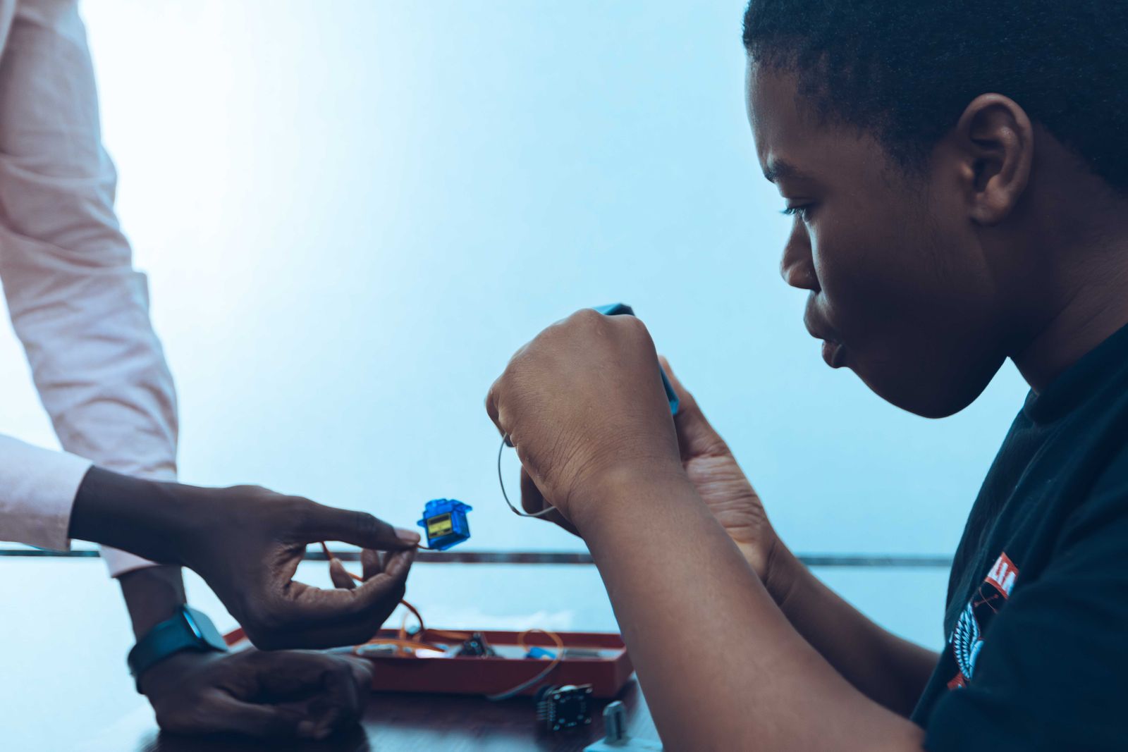 Students building connected electronics during an Accra technology workshop