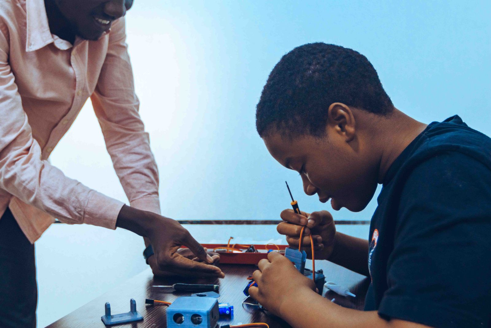 Students receiving hands-on technology mentoring in Accra