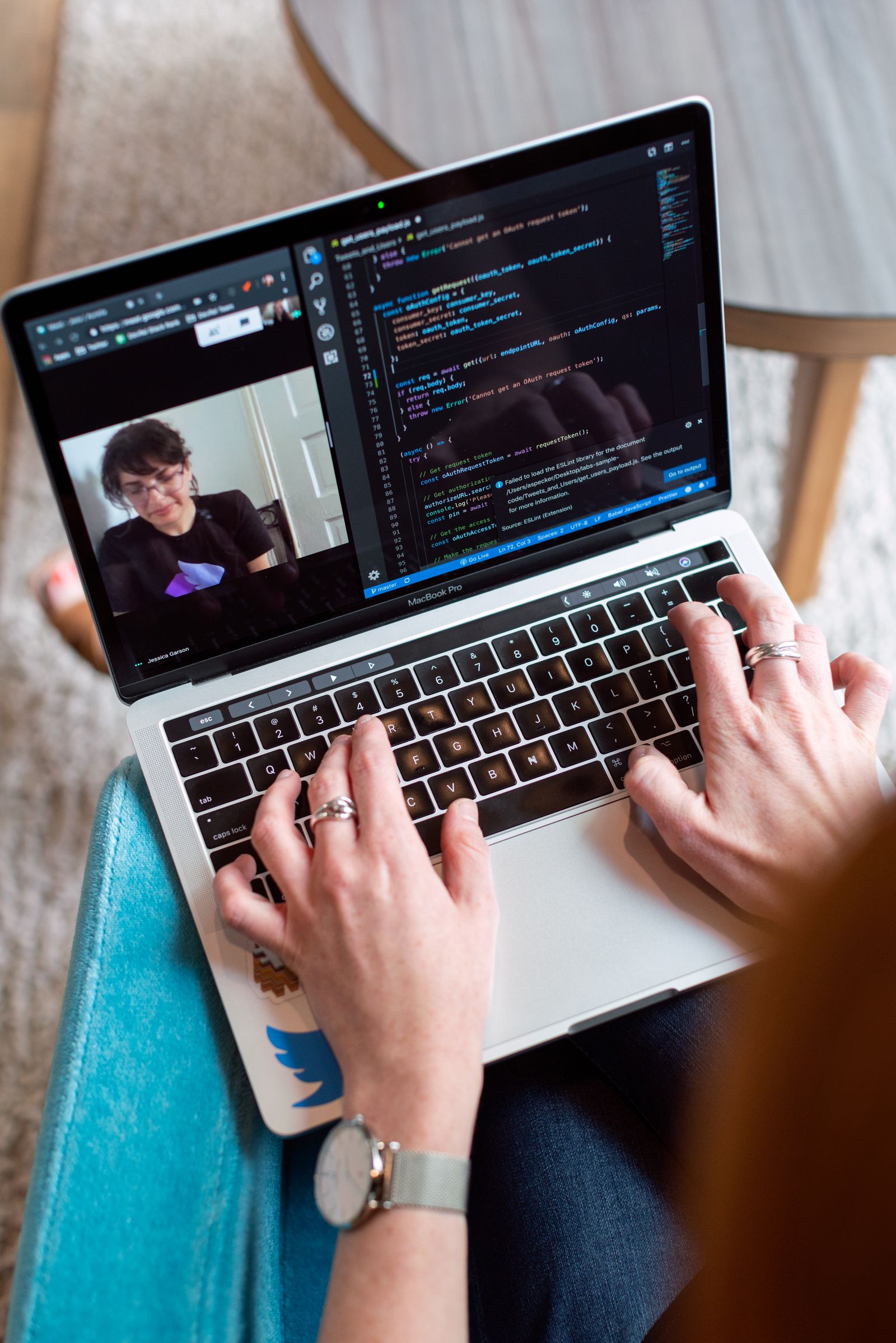 Software developer building applications at a multi-screen workstation