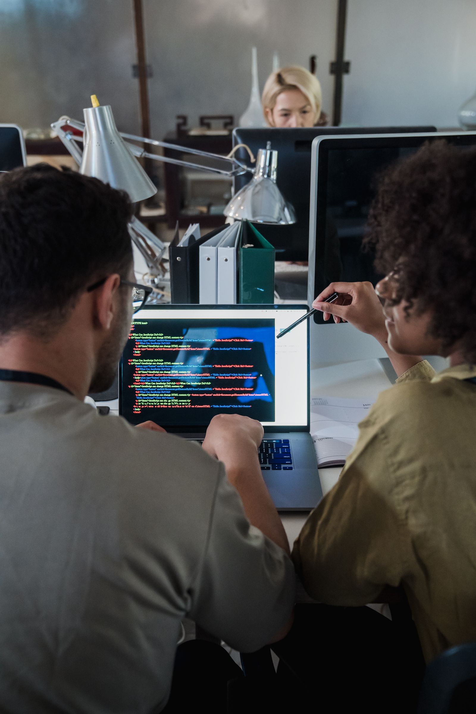 Developers reviewing code together